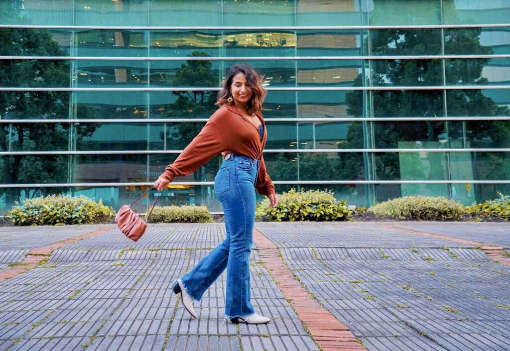 Flared Jeans + Off-Shoulder Top + White Boots